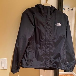 Hooded Black North Face rain jacket.